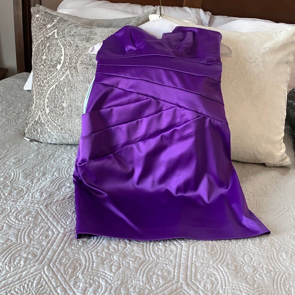 Short, strapless juniors dress in a satin material only worn once. Very pretty.